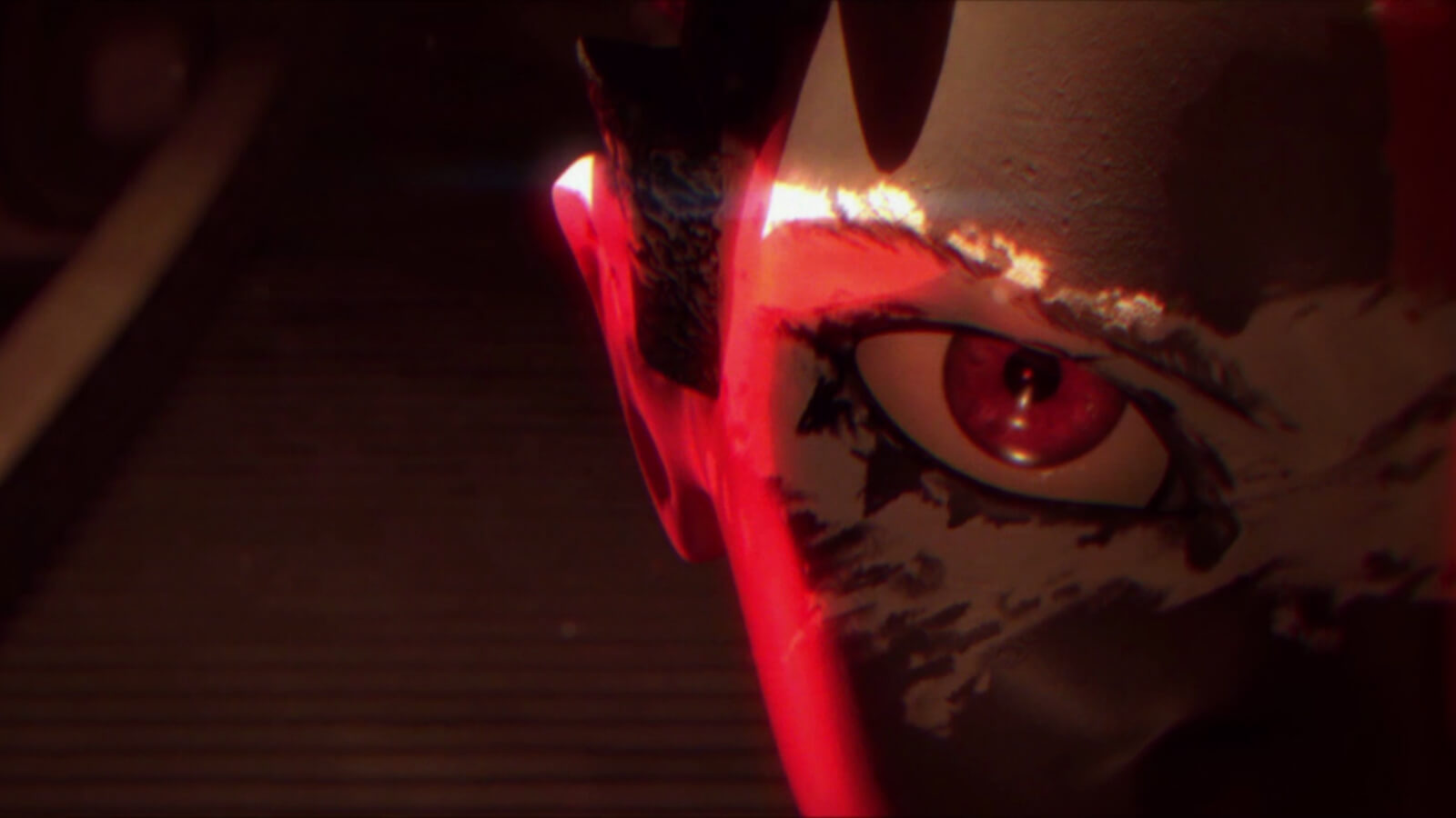 Extreme close up of a face on the right half of the image, including an eye and ear lit by red light