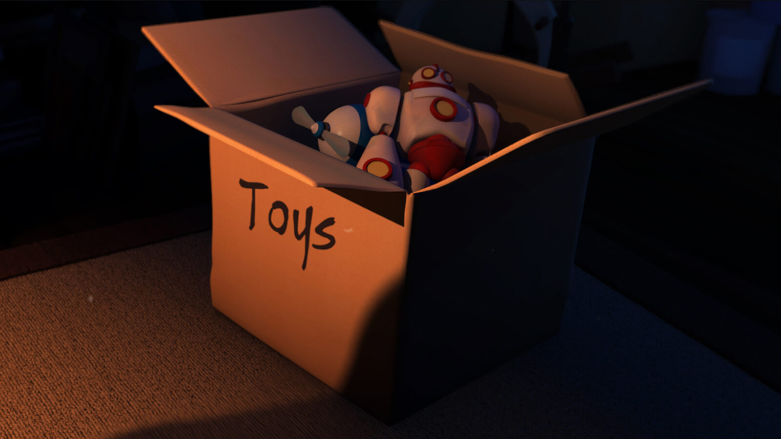A cardboard box in a dark area lit from one side. It contains plastic toys and is labeled &quot;Toys&quot;