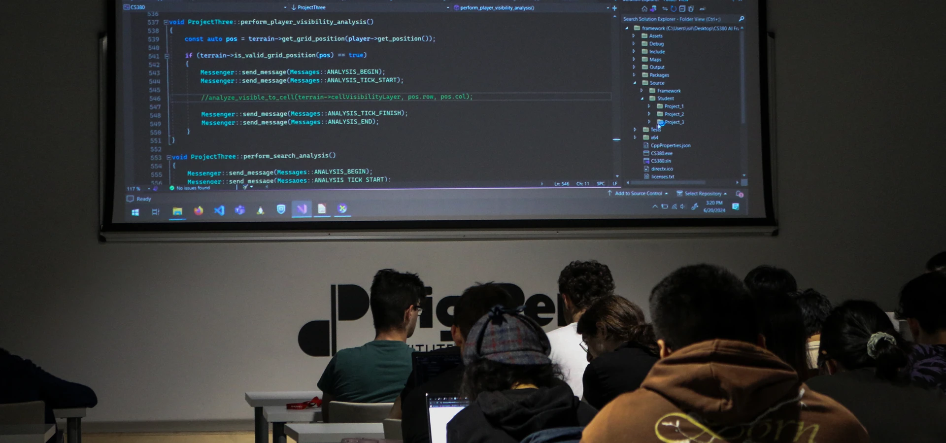 A class with students in which the teacher is reviewing a code snipet