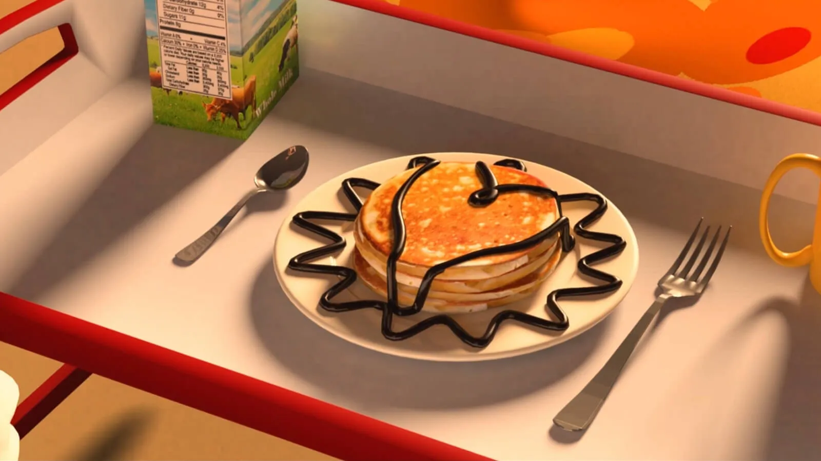 Three pancakes with chocolate drizzled on top sit on a serving tray.