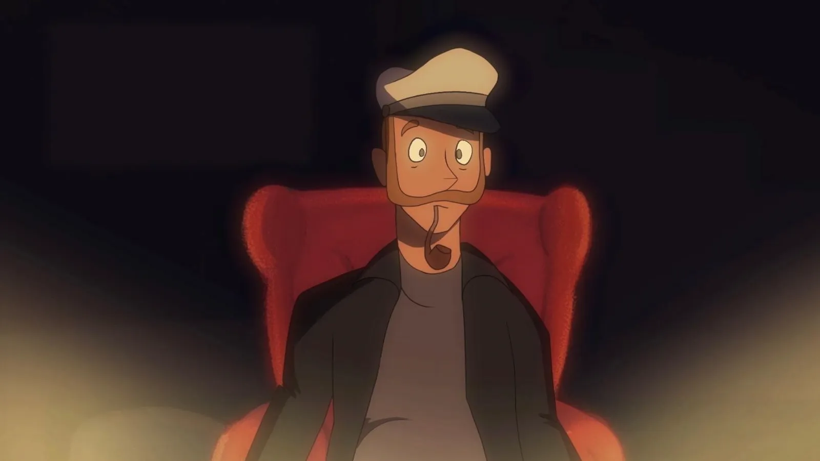 A man with a captain's hat sits in a red armchair, illuminated in the dark. 