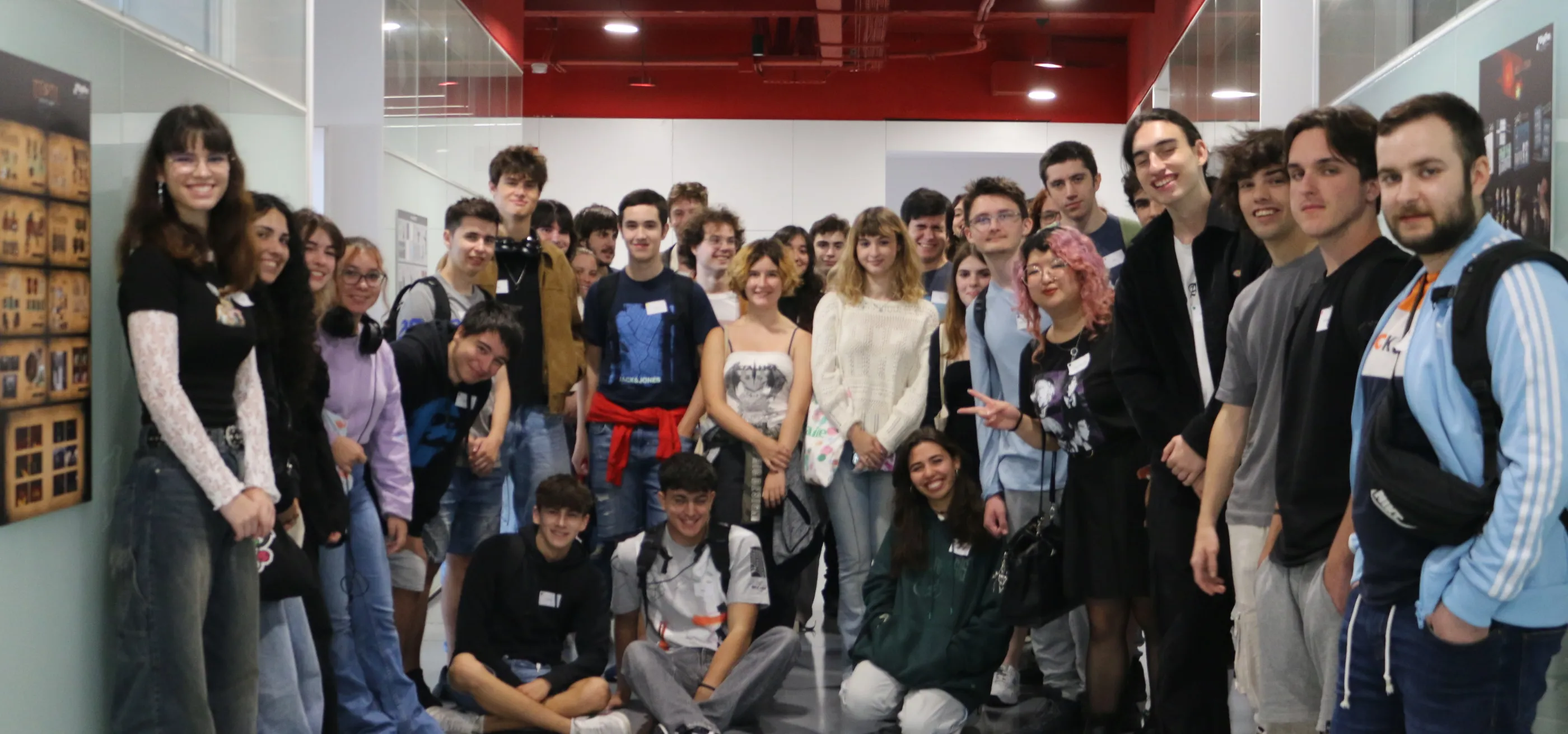 Freshmen students posing in a hallway on their first day at DigiPen Europe - Bilbao.