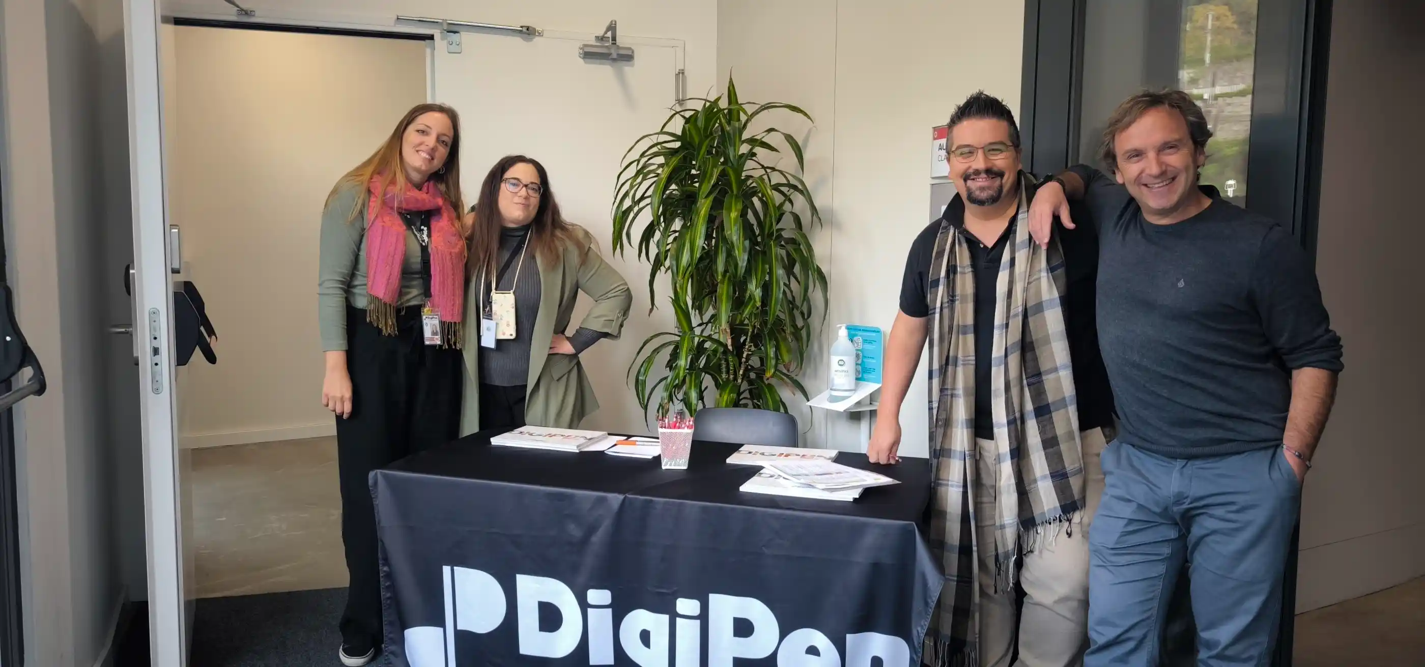 Staff members welcoming visitors at the entrance of DigiPen Europe-Bilbao during last year Open House event