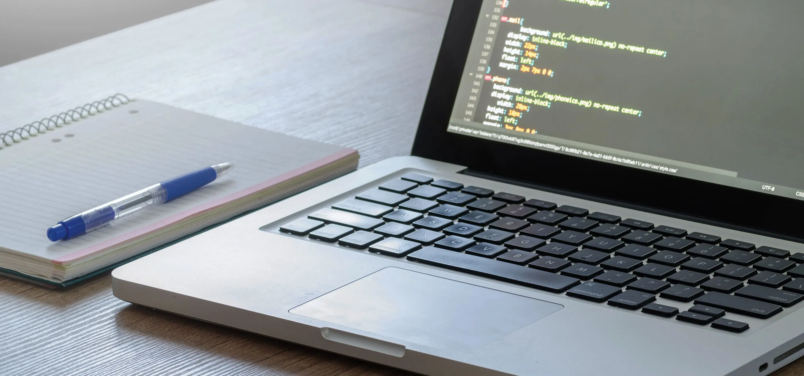 A laptop, a notebook, and a pen ready above; materials prepared for note-taking and starting learning Computer Science