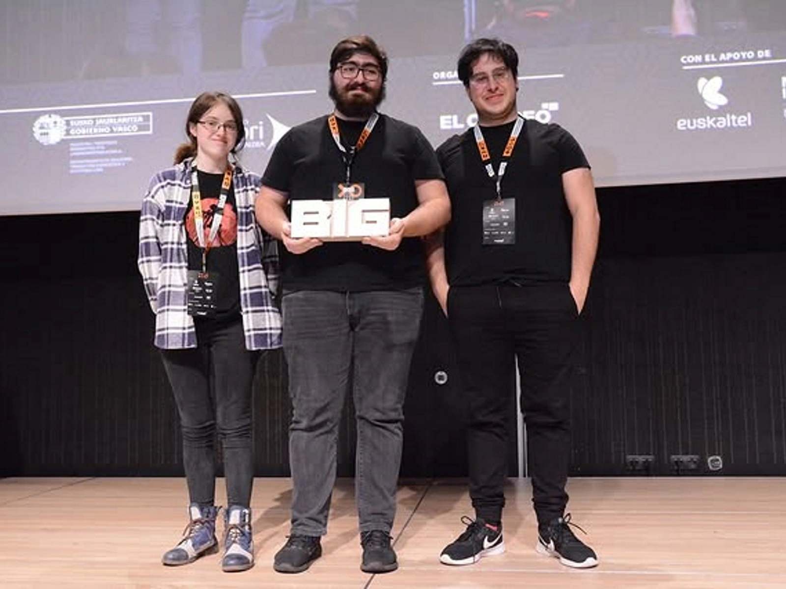 The 'Abyssal' team from DigiPen Europe-Bilbao posing with their trophy after winning the Best Basque Game award at the BIG Conference 2024. 