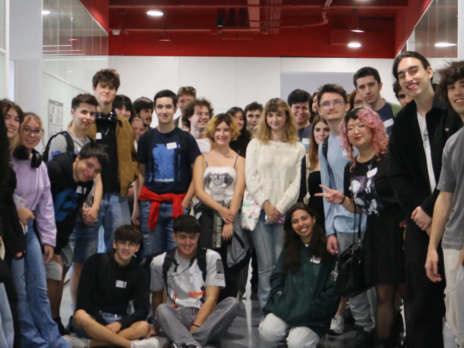 Freshmen students posing in a hallway on their first day at DigiPen Europe - Bilbao.