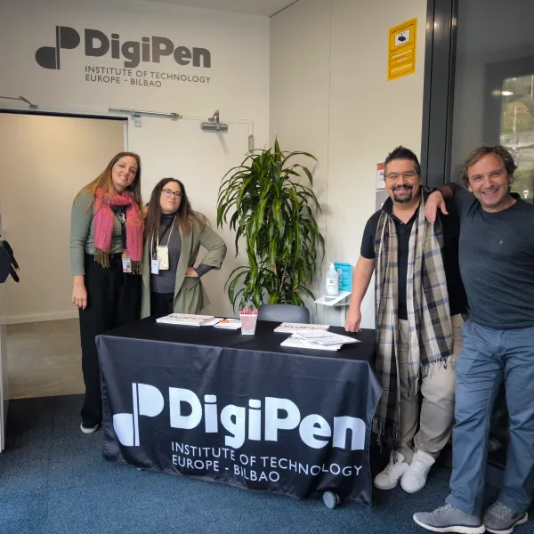 Staff members welcoming visitors at the entrance of DigiPen Europe-Bilbao during last year Open House event