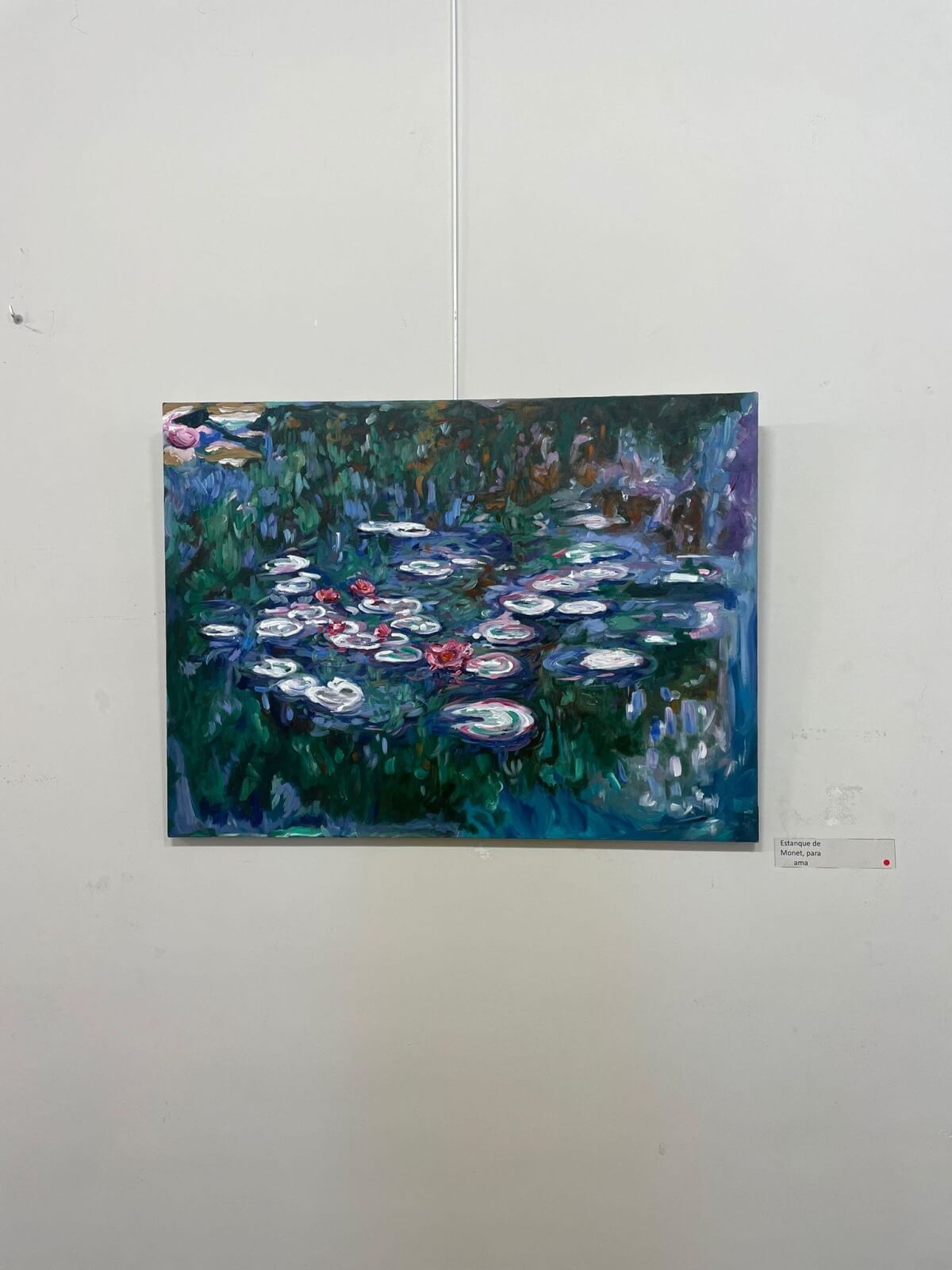 Painting of a pond with water lilies, reminiscent of Monet's style