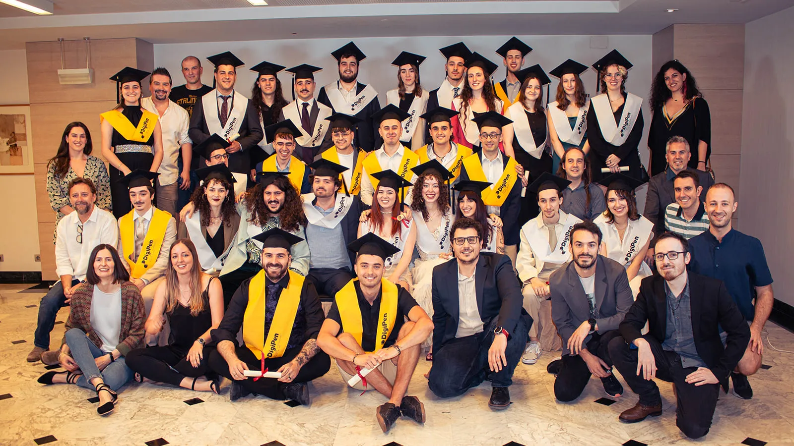 DigiPen Europe-Bilbao’s graduates, professors and staff pose in the set up.