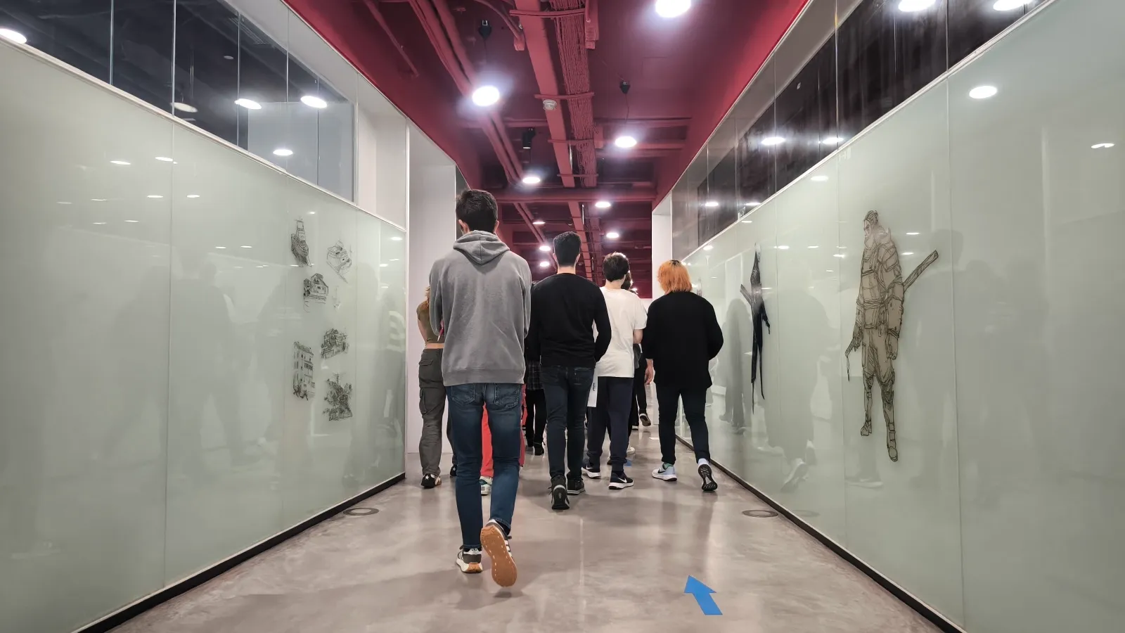 Attendees walking down the hallway at DigiPen Europe-Bilbao during a campus tour.