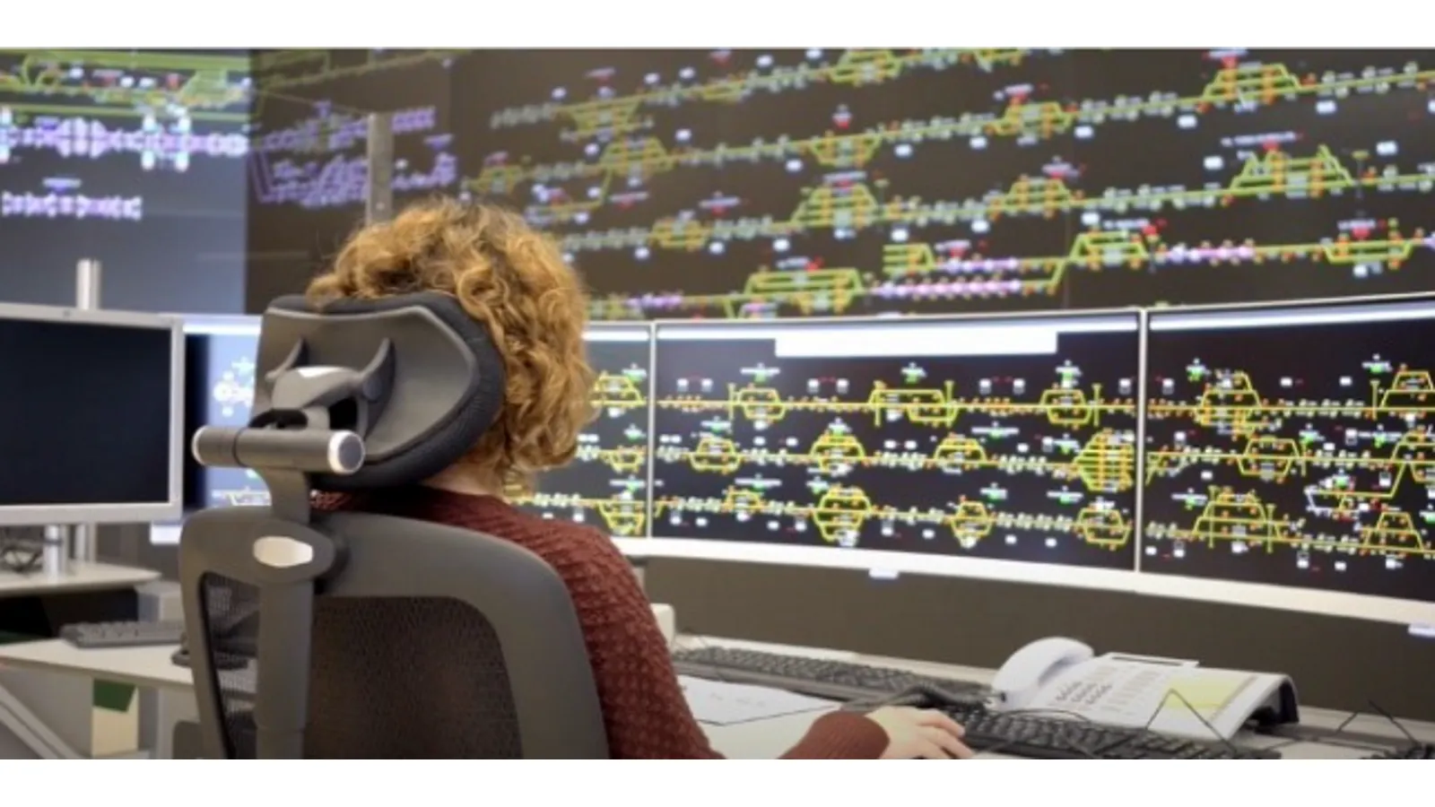 Operator monitors from her computer diagrams detailing rail traffic in real time.