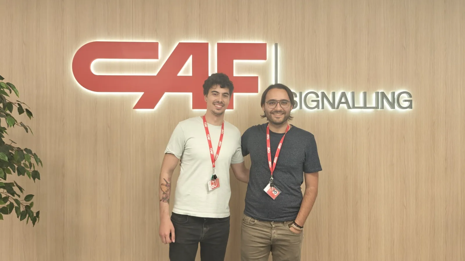 The alumni Mateo Couso and Kerman Munitxa in their actual workplace, the railway company CAF Signalling.