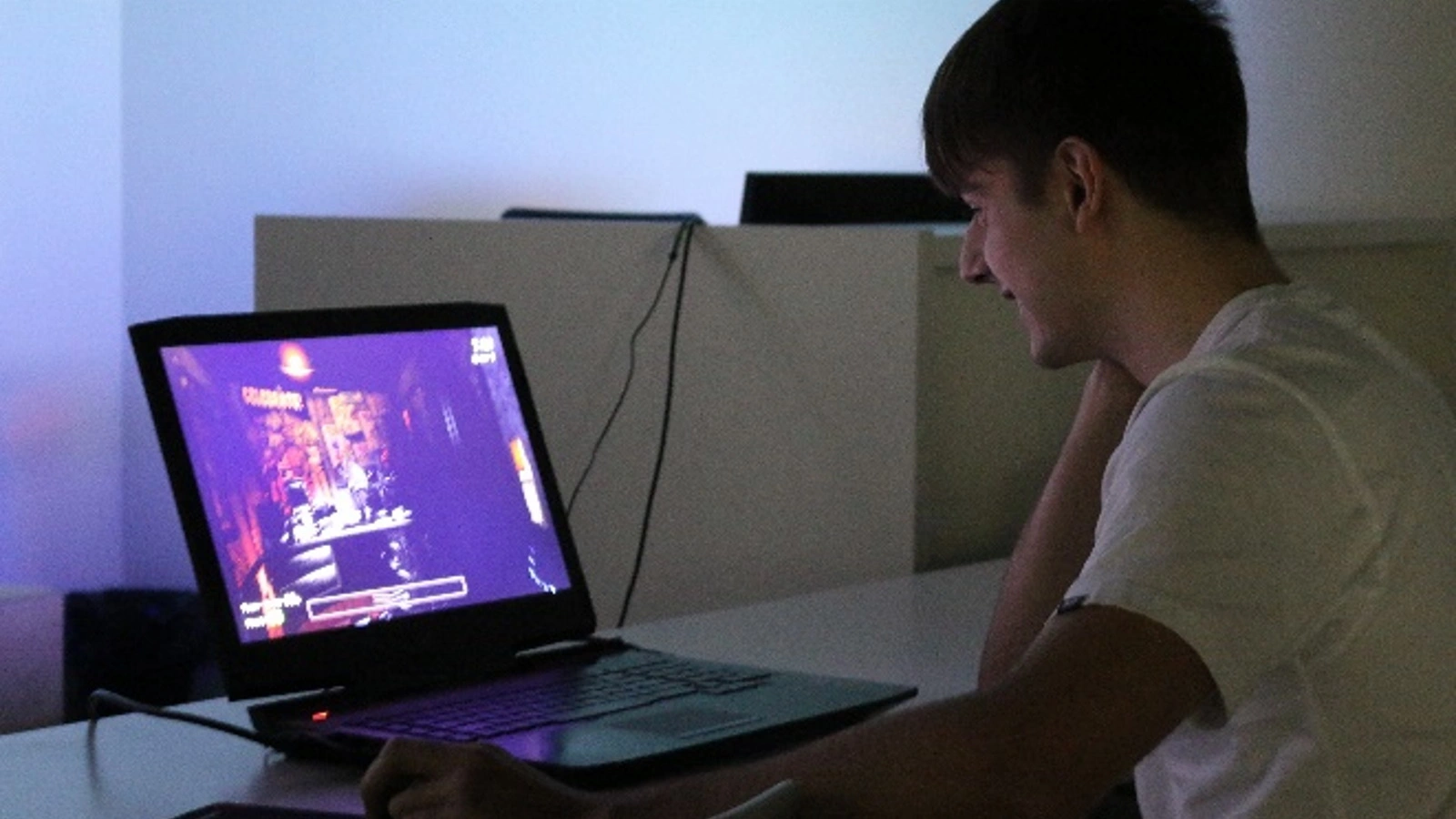 A DigiPen Europe-Bilbao student enjoying a horror game on his laptop during Halloweek’s Horror Game Night.