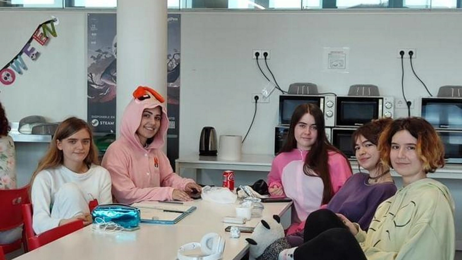 DigiPen Europe-Bilbao students enjoying Pyjama Wednesday, relaxing together in cozy pajamas in the canteen.