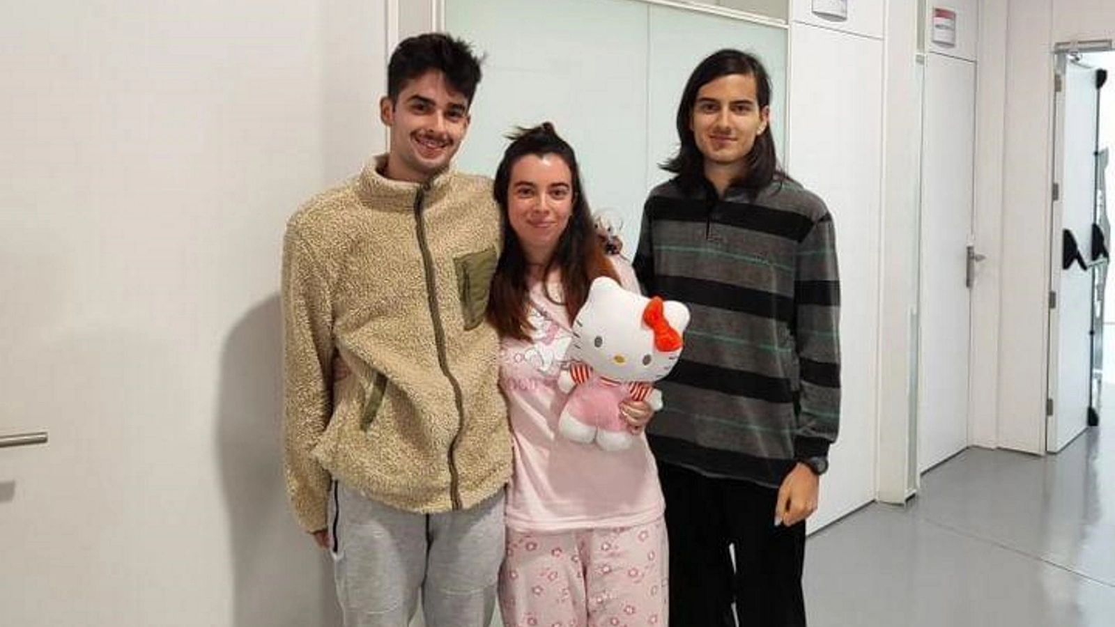 Students posing in their pajamas, one holding a Hello Kitty plush, during DigiPen Europe-Bilbao’s Pyjama Wednesday.